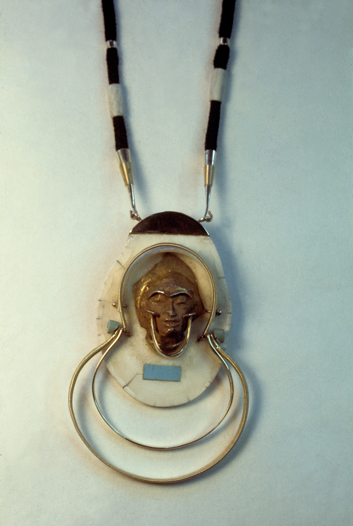 Toza, pendant, gold and ivory with black cord, 1980s