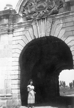 Ruth in an archway in Europe, c. 1940s
