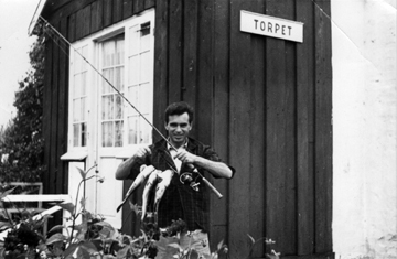 Svetozar holding a fish, in Torpet, Denmark, early 1950s