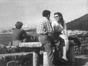 Ruth and Svetozar sitting on a sea wall in Europe, early 1950s