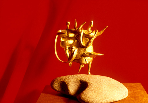 Toza, Sculpture of an abstracted family in gold on a beach stone base, c. 1960s